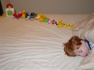 Autistic-sweetiepie-boy-with-ducksinarow